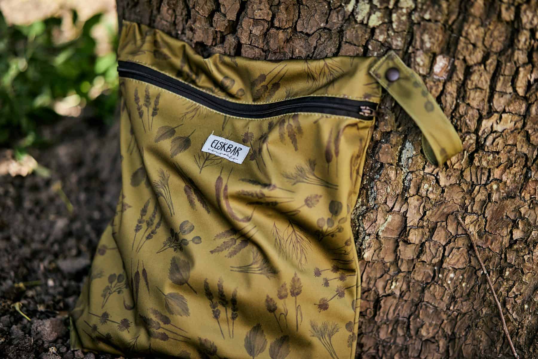Green wetbag by tree