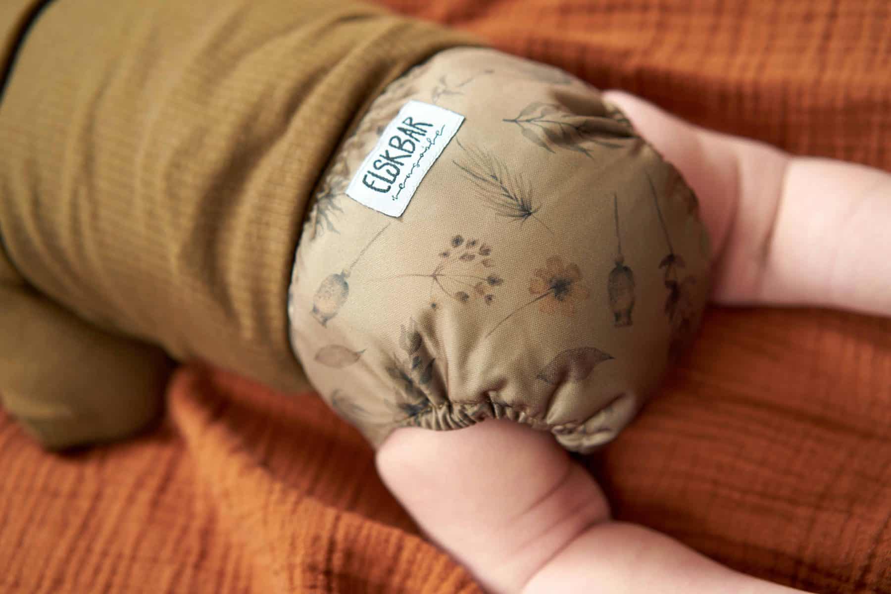 Newborn cloth diaper wildflowers behind